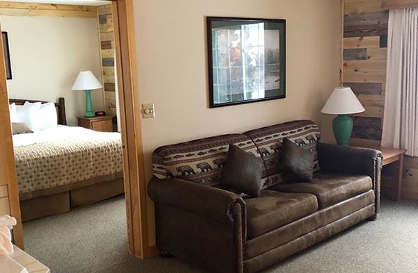 Flat Creek suite couch and bedroom.